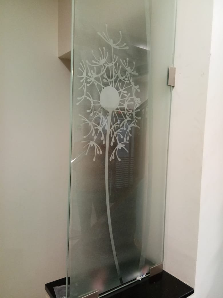 Etched dandelion design on toughened glass
