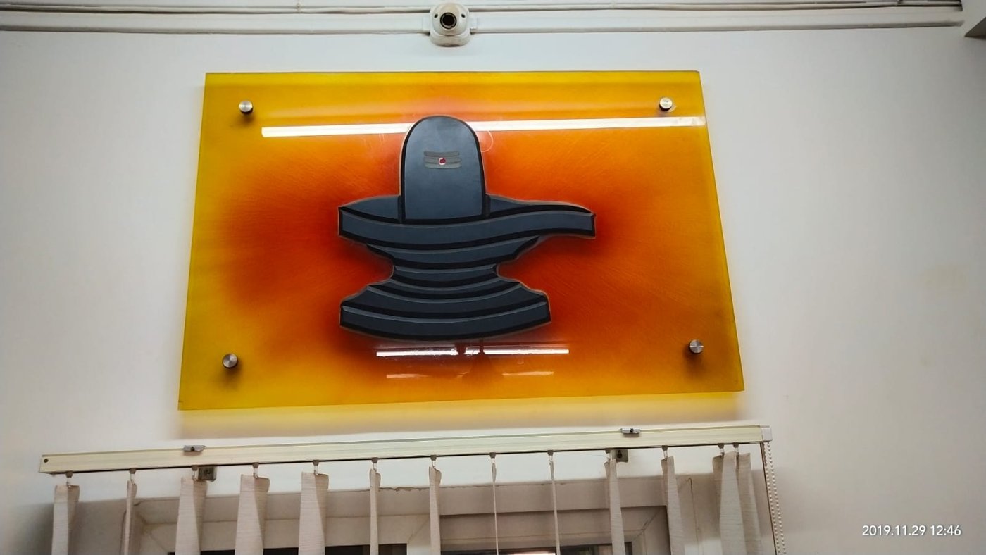 Coloured glass wall panel with Shivling design