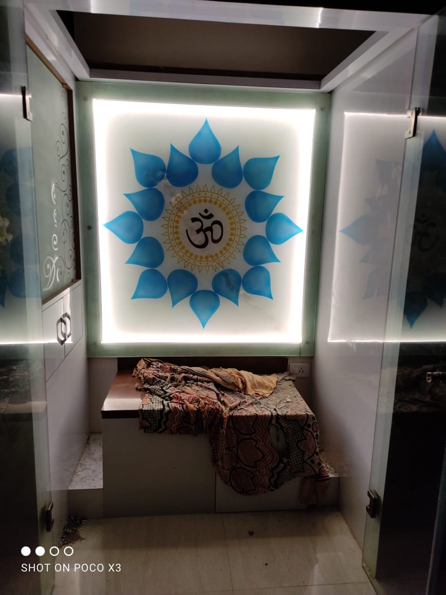 Backlit Om mandala printed glass for a pooja room