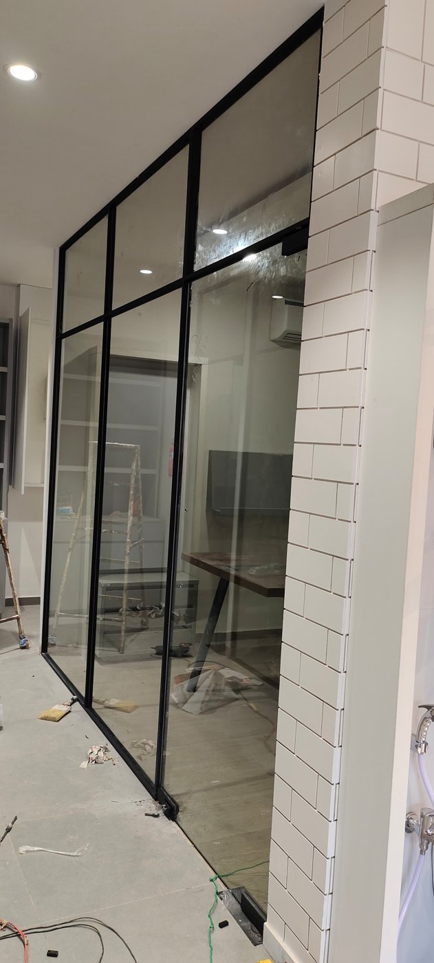 Black-framed glass partition for an office