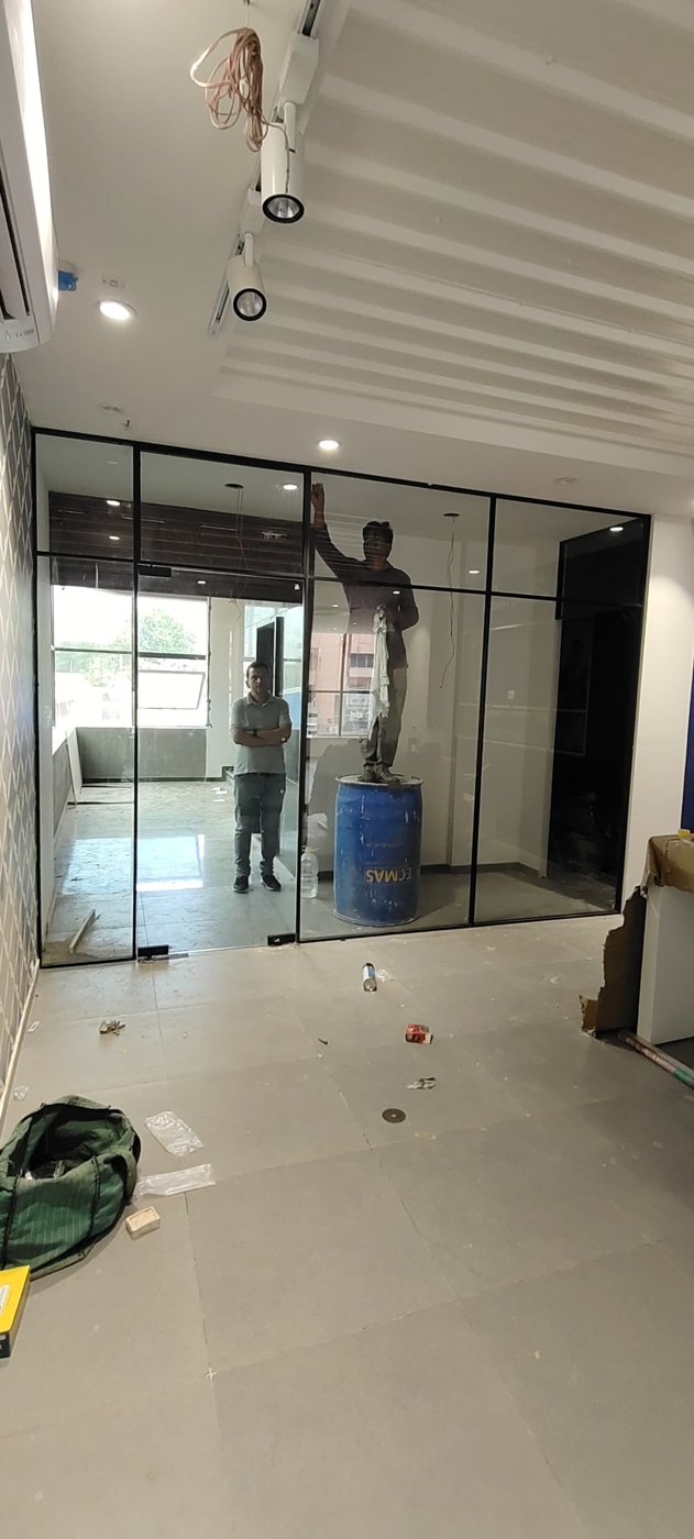 Black-framed glass partition and door for a cabin