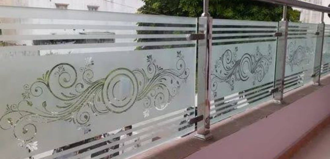 Etched frosted glass railing with scroll design