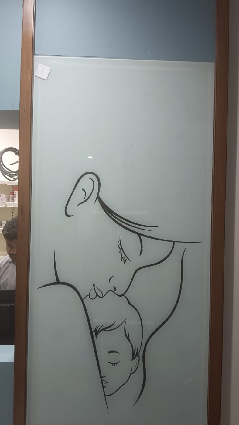 Frosted glass with mother and child line art