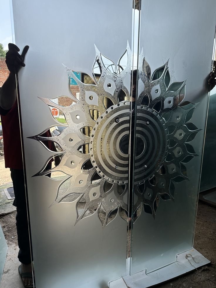 Frosted glass with mirror-cut mandala design